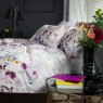 The Lyndon Company Watercolour Lavender Meadow Duvet Cover Set side on lifestyle image of the bedding