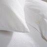 The Lyndon Company White Morocco Duvet Cover Set close up image of the bedding and pillow