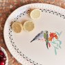 Cath Kidston Painted Table 36cm Ceramic Oval Plate lifestyle image of the plate with lemons
