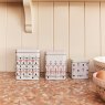 Cath Kidston Painted Table Set of 3 Stacking Storage Tins lifestyle image of the tins
