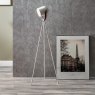 Auden White Metal Tripod Floor Lamp lifestyle image of the lamp
