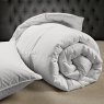 Softened Goose Feather Down Duvet image of the duvet rolled up on a bed lifestyle image