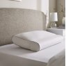 The Fine Bedding Company Cooling Head & Neck Pillow lifestyle image of the pillow on the bed