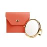 Alice Wheeler Orange Luxury Travel Mirror And Case image of the mirror and case on a white background
