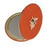 Alice Wheeler Orange Round Compact Mirror image of the mirror open on a white background