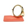 Alice Wheeler Orange Mirror And Pouch image of the mirror and pouch on a white background