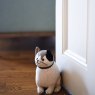Dora Designs Fat Cat Pudge Doorstop lifestyle image of the doorstop