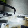 Tower Black And Rose Gold Handheld Steam Cleaner lifestyle image of the steam cleaner