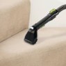 Daewoo Hurricane 1.4L Carpet Spot Washer lifestyle image of the spot cleaner hose in use