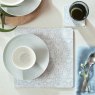 Denby Grey Floral Set Of 6 Placemats lifestyle image of the placemat