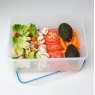 Addis Clip Tight 5.3L Rectangular Container lifestyle image of the container with the lid off on a white surface