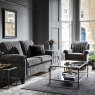 Duresta Southsea Low Back Chair lifestyle image of the chair with the sofa