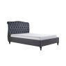 Beatrice Bedstead In Dark Grey angled image of the bed with mattress on a white background