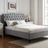 Beatrice Bedstead In Light Grey angled lifestyle image of the bedstead