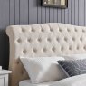 Beatrice Bedstead In Natural close up lifestyle image of the headboard of the bedstead