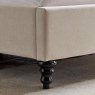 Beatrice Bedstead In Natural close up lifestyle image of the front foot of the bedstead