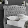 Beatrice Ottoman In Light Grey close up lifestyle image of the headboard of the ottoman bed