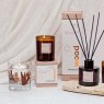 Stoneglow Wood Elements Palo Santo & Amber Botanical Wax Tumbler lifestyle image of the candle