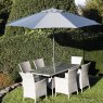 Havana 6 Seater Rectangular Dining Set lifestyle image of the dining set with parasol