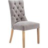 Grey Curved Button Back Dining Chair angled image of the dining chair on a white background
