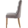 Grey Curved Button Back Dining Chair side on image of the chair on a white background