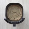 Tower 4 Pack 5-7L Brown Parchment Air Fryer Liners lifestyle image of the liner in an air fryer