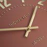 Thomas Kent Arabic 12" Auburn Wall Clock close up image of the clock on a white background