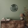 Thomas Kent Arabic 12" Olive Green Wall Clock lifestyle image of the clock