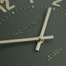 Thomas Kent Arabic 12" Olive Green Wall Clock close up image of the clock on a white background