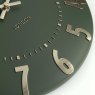 Thomas Kent Arabic 12" Olive Green Wall Clock close up image of the clock on a white background