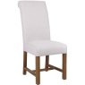 Scroll Back Dining Chair In Natural angled image of the chair on a white background