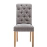 Button Back Scroll Top Dining Chair In Grey front on image of the chair on a white background