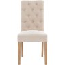 Button Back Scroll Top Dining Chair In Natural front on image of the chair on a white background