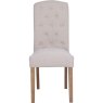 Button Back Dining Chair In Natural front on image of the chair on a white background
