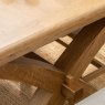 Manor Oak 2m Extending Crossed Leg Dining Table With 5 Cross Back Chairs & Bench close up lifestyle image