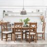 Manor Oak 1.3m Extending Crossed Leg Dining Table With 6 Cross Back Chairs lifestyle image