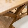 Manor Oak 1.3m Extending Crossed Leg Dining Table With 6 Cross Back Chairs close up lifestyle image