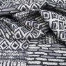 Close up of the rippled Tunisia fabric in Black