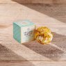 Clementine & Fizz Bath Melt Truffle 40g on wooden background