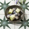 Wild Lemongrass Bath Melt Truffle 40g in bowl on tiled floor